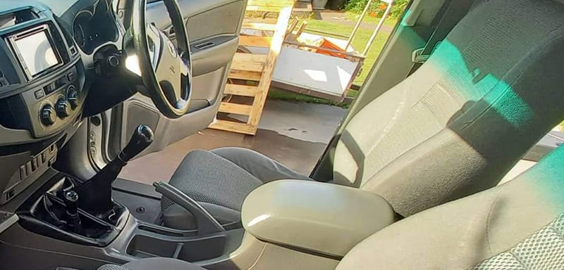 Protective coating applied to vehicle upholstery