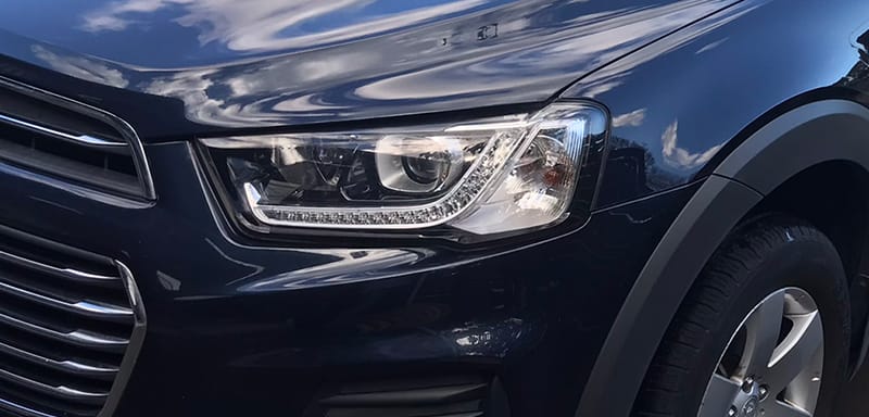 Headlight restoration returning a clouded lens to clear